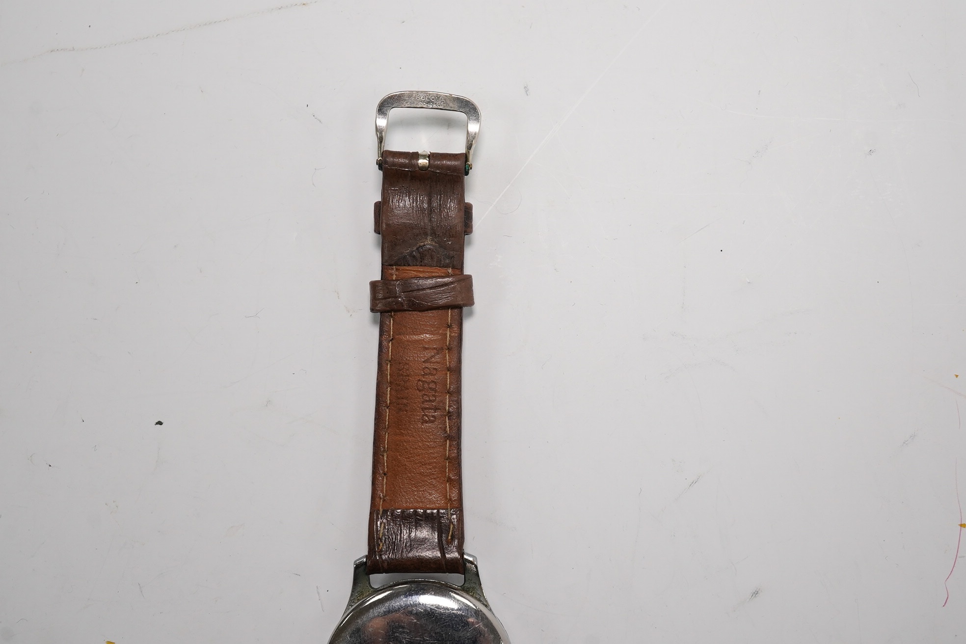 A gentleman's steel Russian manual wind wrist watch, the dial inscribed Kupoba, with Arabic dial, case diameter 34mm. Condition - poor